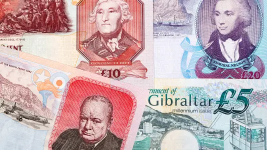 An image showing several banknotes of Gibraltar pound, such as 5 GIP, 10 GIP, and 20 GIP