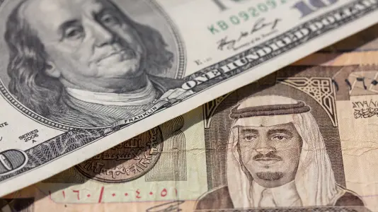 An image of US dollar and Kuwaiti dinar