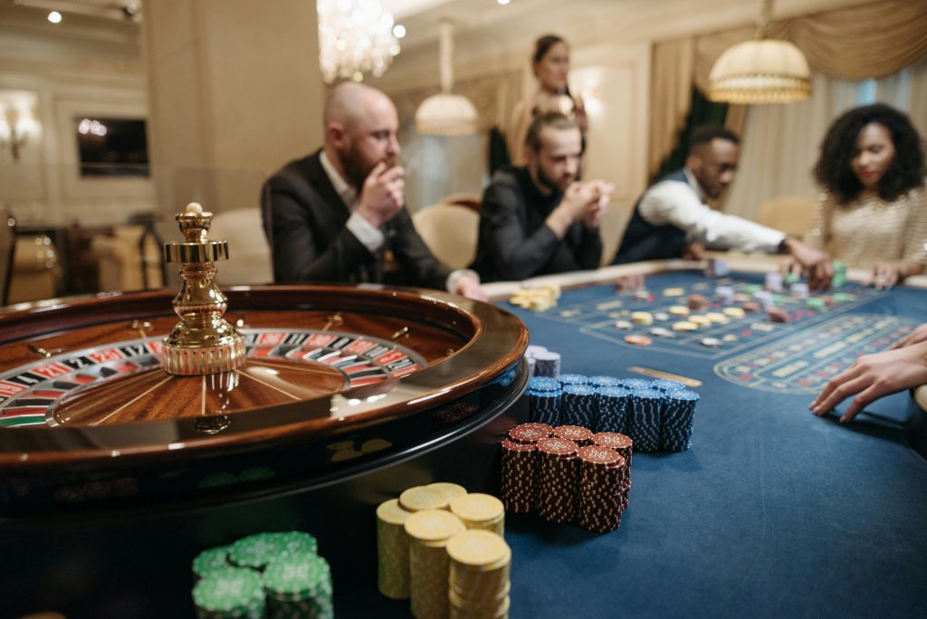 An image of a group of people gambling