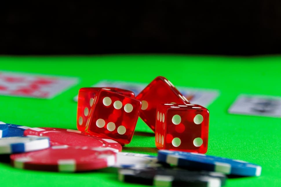 An image with dice, poker, and the cards