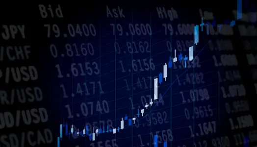 Image of a Japanese candlestick chart overlayed on a forex market watch to represent forex trading