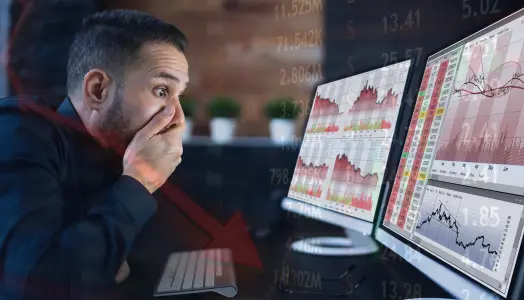 Image of a person monitoring a forex chart movement with a shocked expression on their face