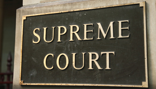 An image of a signage of the supreme court