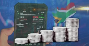 Image of silver coins and silver price south africa on top of stock market photo