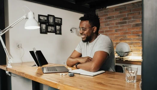 An image of a man having a videoconference meeting to represent working from home